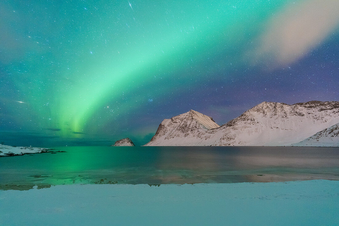 Aurora Borealis over Haukland beach covered with snow, Vestvagoy, Nordland, Lofoten Islands, Norway