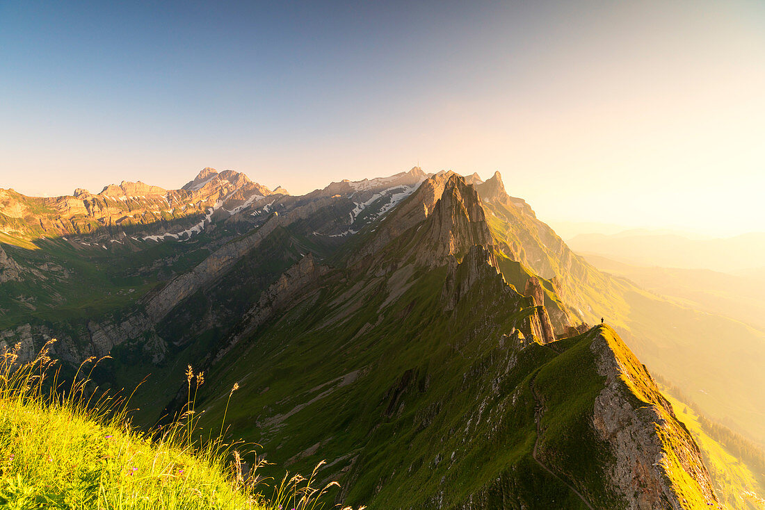 Mist on the rocky peak of Santis at sunset seen from Schafler, Appenzell Innerrhoden, Switzerland