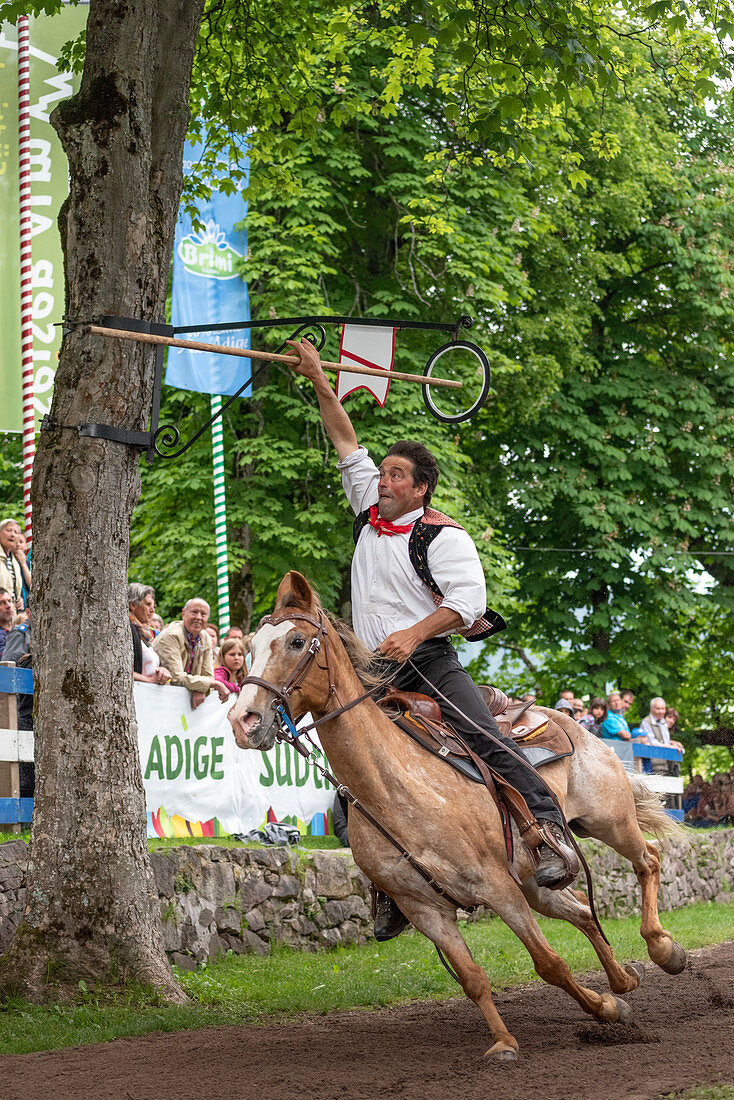 Castelrotto / Kastelruth, South Tyrol, Italy. The traditional ring jousting at the Mount Calvario in Castelrotto