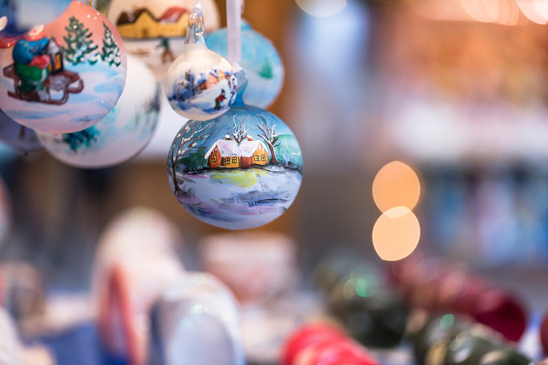 a detail of hand painted Christmas balls into the traditional Christmas Markets in South Tyrol, Bolzano province, Trentino Alto Adige, Italy