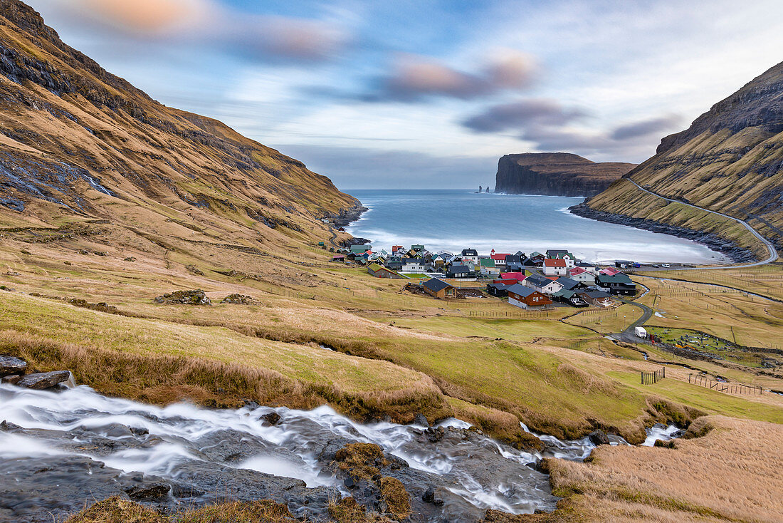 The cove of Tjornuvik and in background near the cliff the two sea stacks of Risin and Kellingin (Streymoy island, Faroe Islands, Denmark)