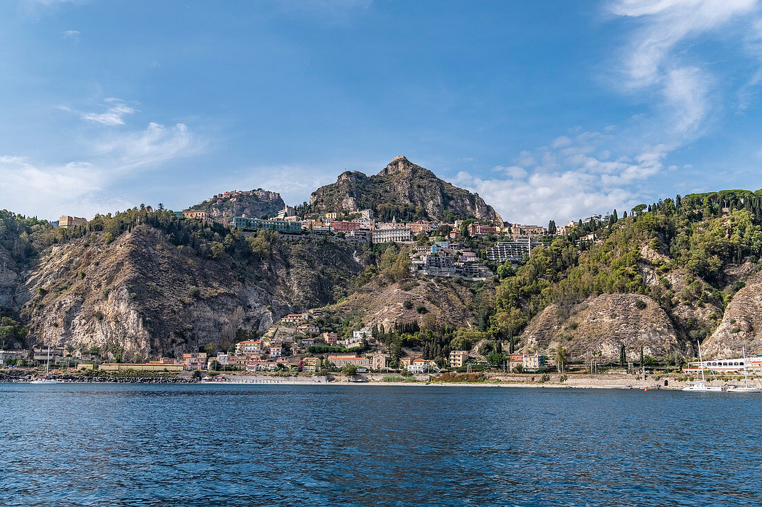 View from the water to the coast of Taormina, Sicily, South Italy, Italy