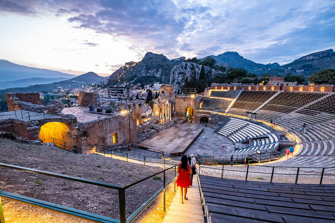 View to the Teatro di Antico of Taormina at the sunset with Etna and the Sea in the backround, Taormina, Sicily, South Italy, Italy
