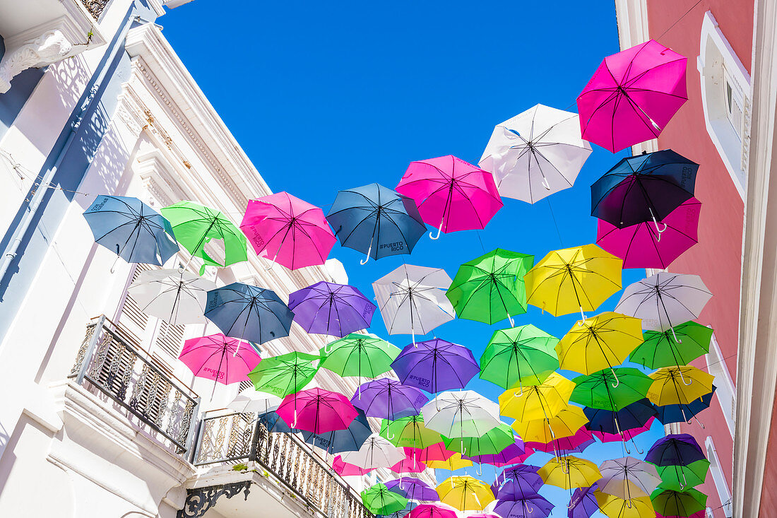 Umbrellas as a tourist attraction in Calle Fortaleza, Old Town, San Juan, Puerto Rico, Caribbean, USA