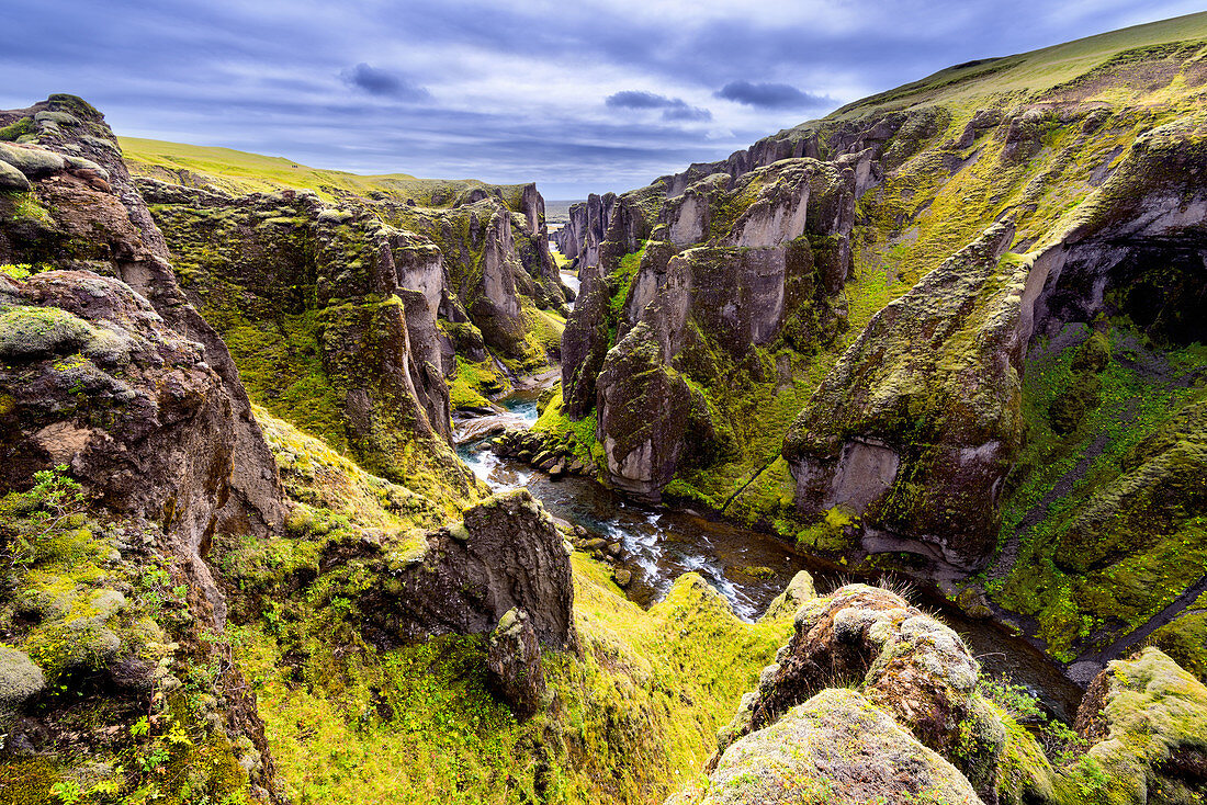 Mossy green sides of Fjadrargljufur canyon in Iceland, Europe