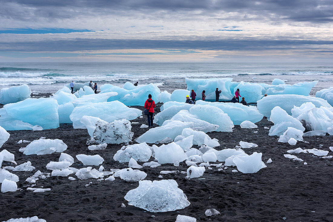 Tourists admiring the Skaftafelljökull glacier landscape in Iceland, Europe