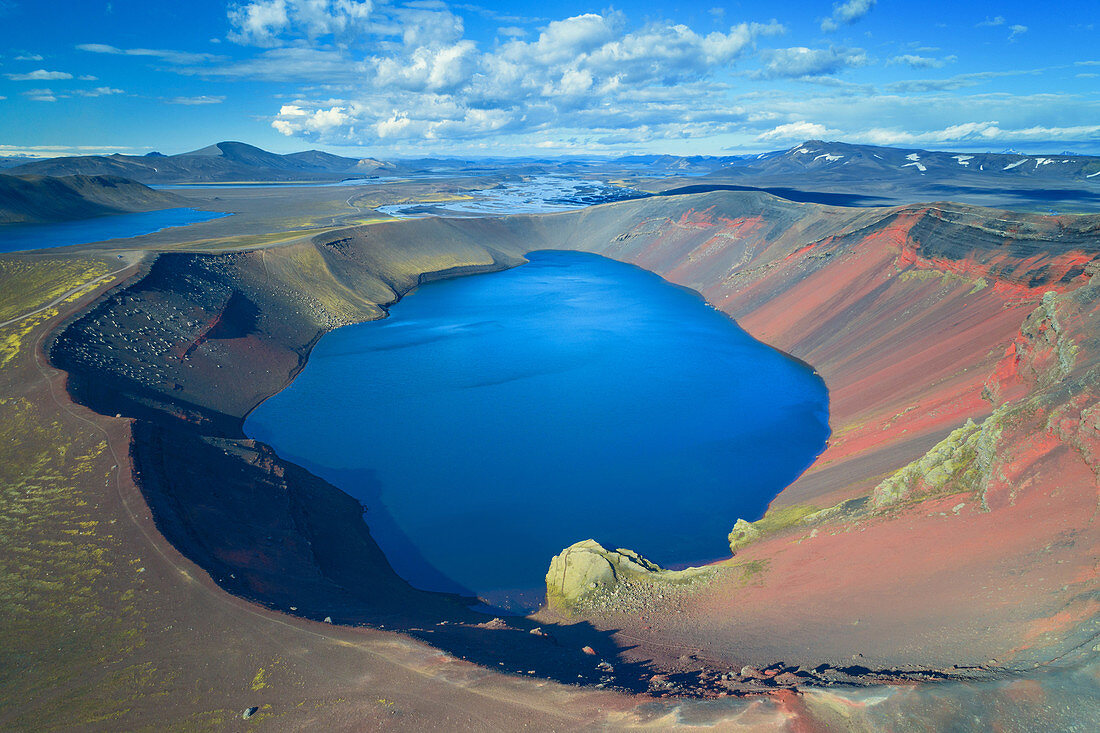 Aerial photograph of bright blue Ljotipollur crater lake in Iceland, Europe