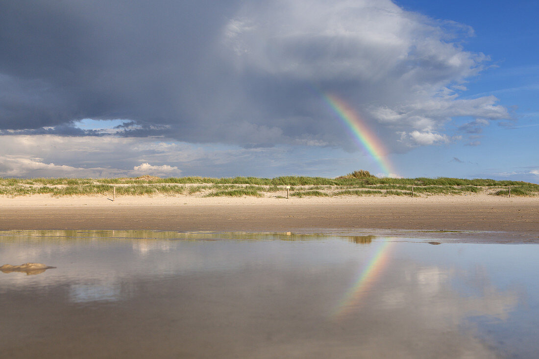 Rainbow over the beach in St. Peter-Ording, peninsula Eiderstedt, North Frisia, Schleswig-Holstein, Northern Germany, Germany, Europe