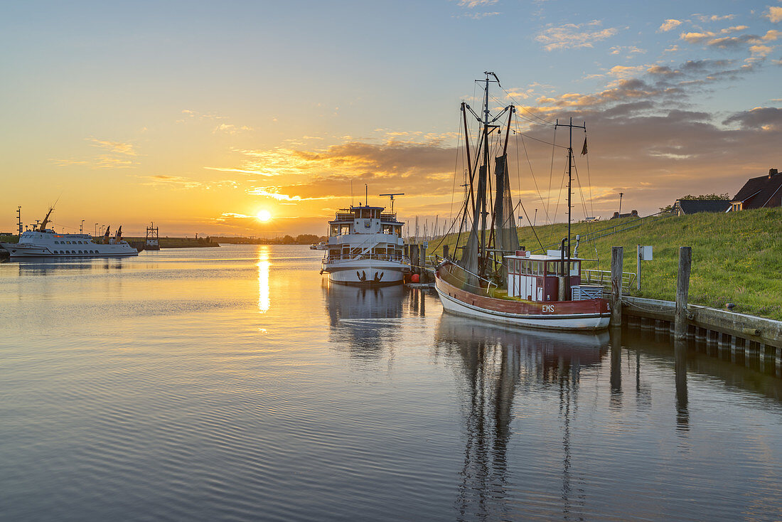 Sunrise above the harbour of Greetsiel, North Sea, East Frisia, Lower Saxony, Northern Germany, Germany, Europe