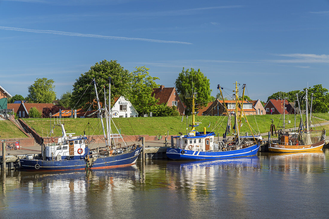 Fishing boats in the harbour of Greetsiel, North Sea, East Frisia, Lower Saxony, Northern Germany, Germany, Europe