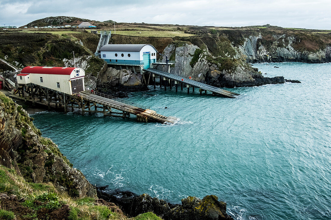 View of the new and old boat houses, St Davids Lifeboat Station in St. Justinian, Pembrokeshire, Wales.