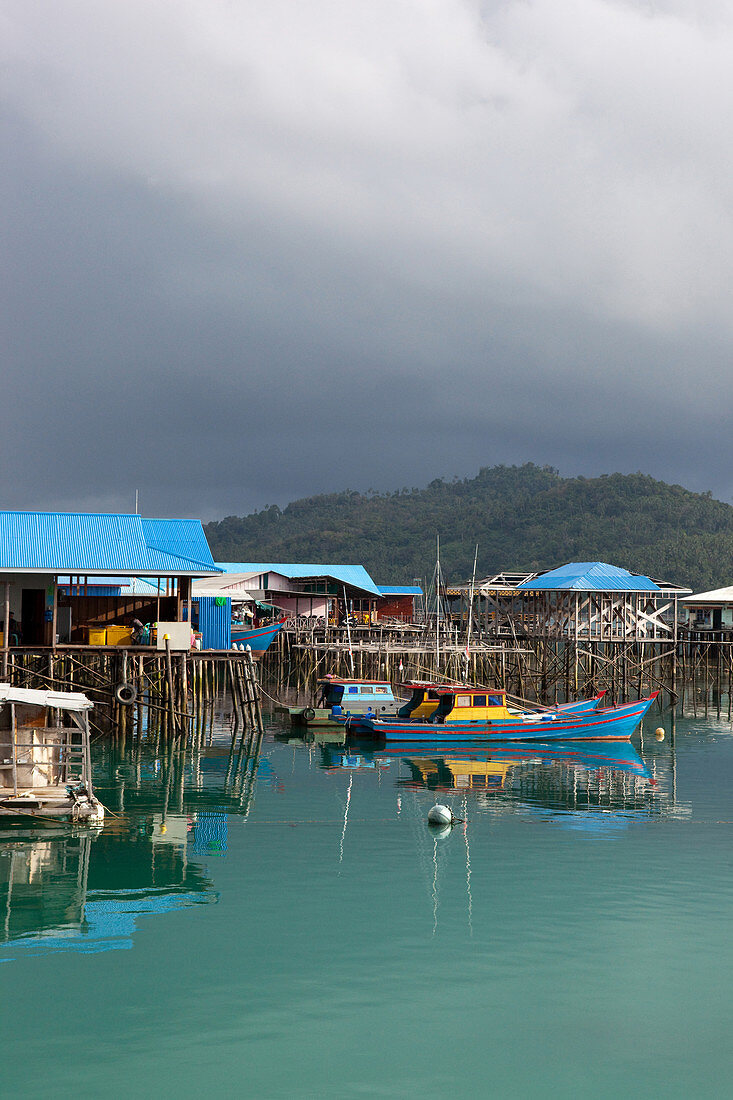 Fishing boats in the bay of Letung in the rain, Letung, Jemaja, Anambas, Indonesia