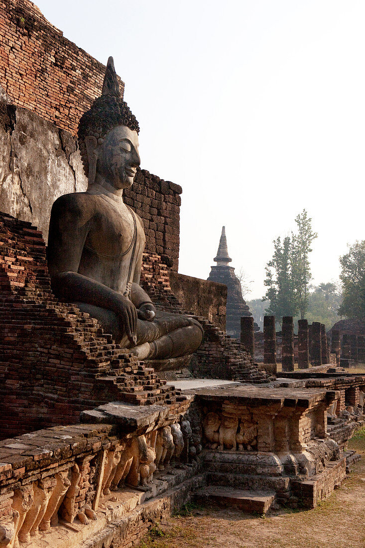Sitting Buddha in the Historical Park of Sukhothai in the temple Wat Mahathat, ancient royal city, Sukhothai, Thailand