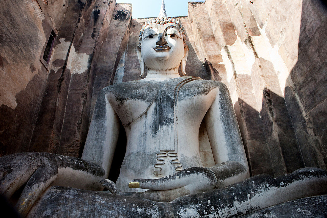 Sitting Buddha in the Historical Park of Sukhothai in the temple Wat Si Chum, ancient royal city, Sukhothai, Thailand
