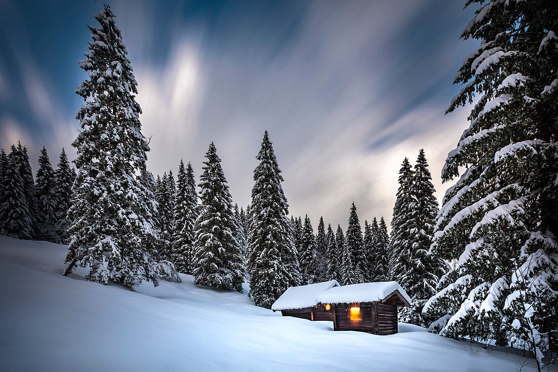 Wooden huts in winter landscape at Barmsee in Krün. Krün, Mittenwald, Bavaria, Germany, Europe