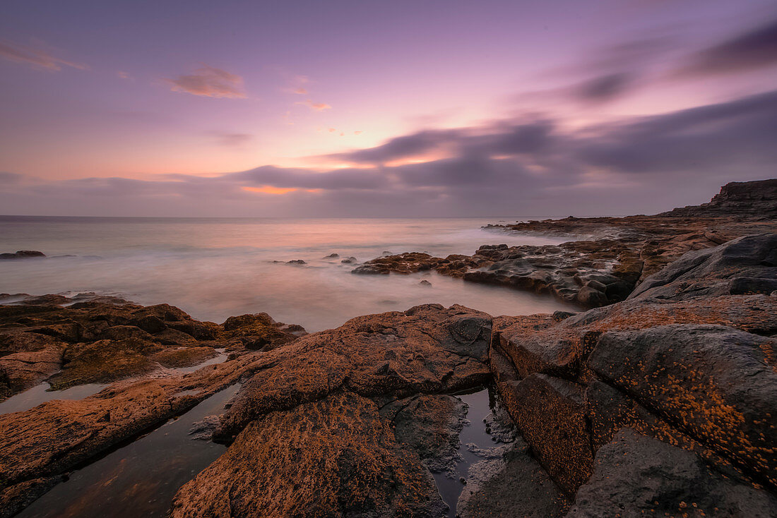 Evening mood on the coast Punta Pechiguera with rocks and stones. Pechiguera, Lanzaroto, Canary Islands, Spain, Europe