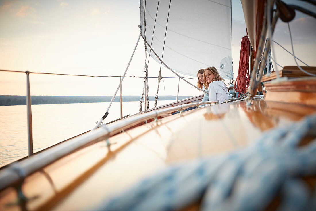 Two 9-year-old girls aboard the two-master Sir Shackleton, Ammersee, Bavaria Germany