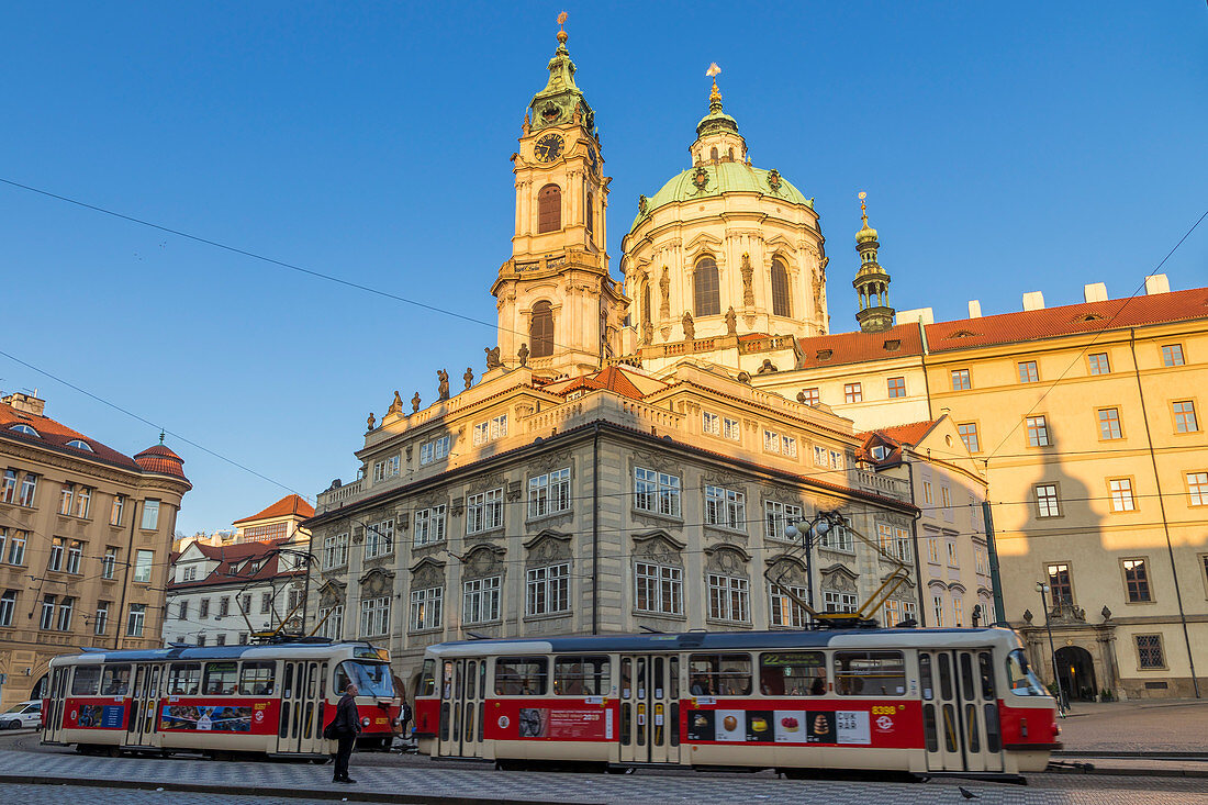 The famous tram no. 22 passing the Malostranske Namesti Square and St. Nicholas Church, Prague, Bohemia, Czech Republic, Europe