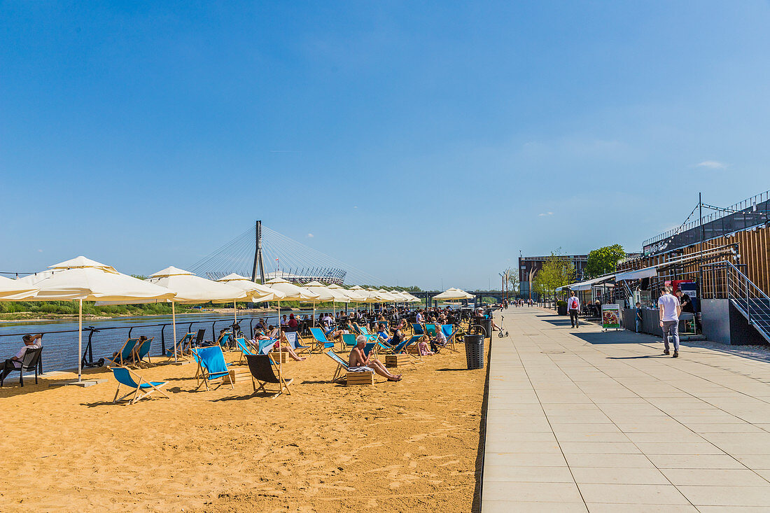 The beach and outdoor restaurants along the Vistulan Boulevards beside the Vistula River, Warsaw, Poland, Europe