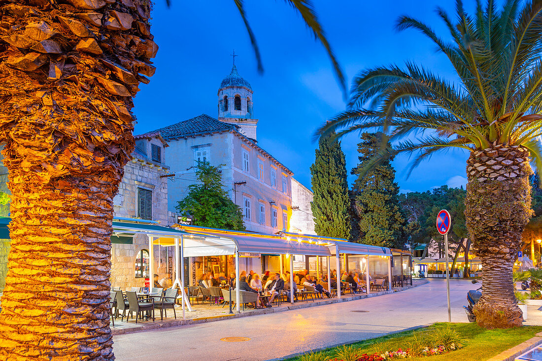 View of restaurants and church at dusk, Cavtat on the Adriatic Sea, Cavtat, Dubrovnik Riviera, Croatia, Europe