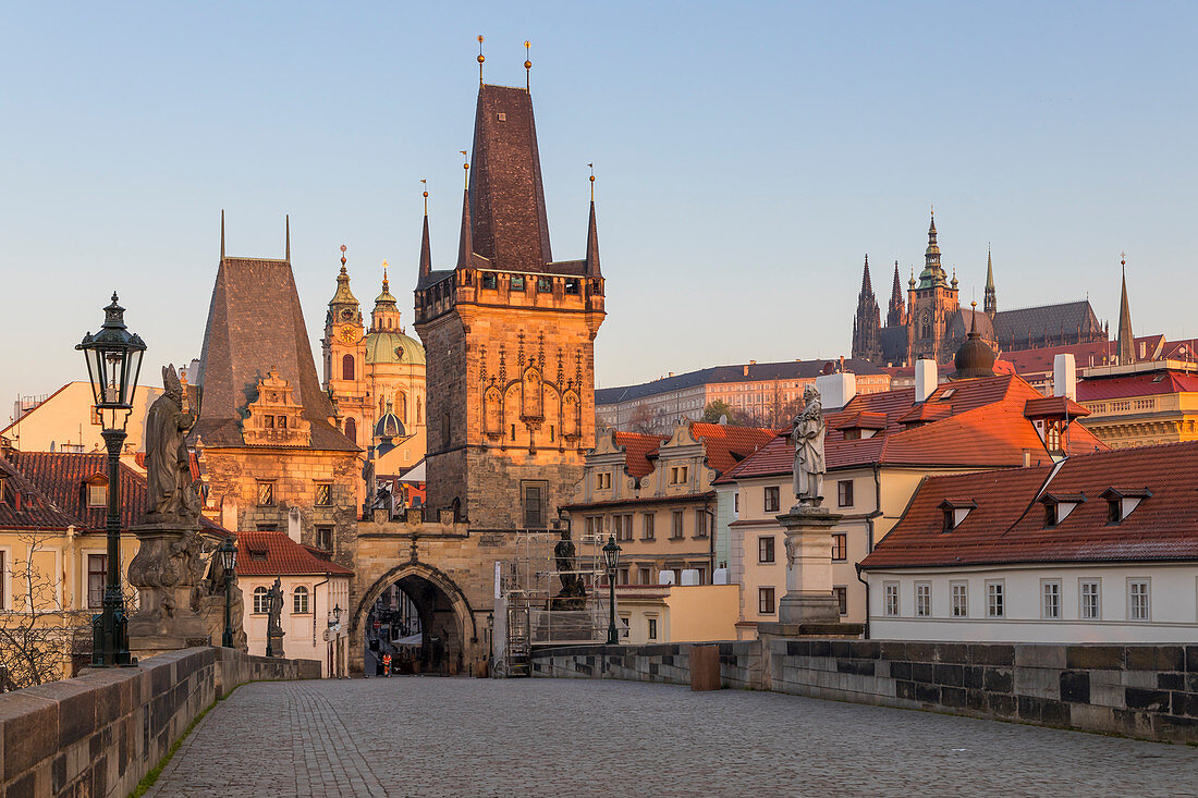 The Lesser Town Bridge Tower and St. Vitus Cathedral seen from Charles Bridge at first sunlight, UNESCO World Heritage Site, Prague, Bohemia, Czech Republic, Europe