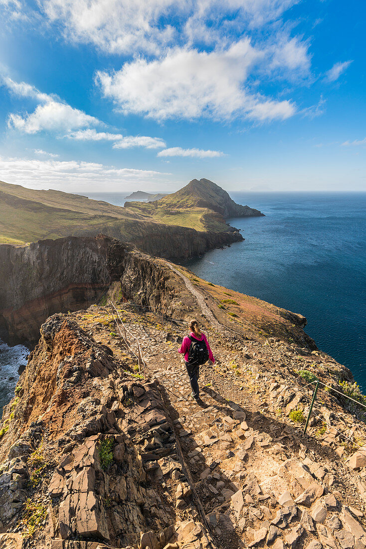 Woman walking on the trail to Point of Saint Lawrence. Canical, Machico district, Madeira region, Portugal.
