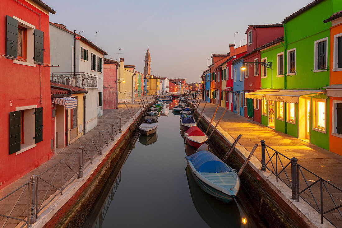 The typical colored houses with Rio della Giudecca Canal at sunset, Burano Island, Venice, Veneto, Italy.