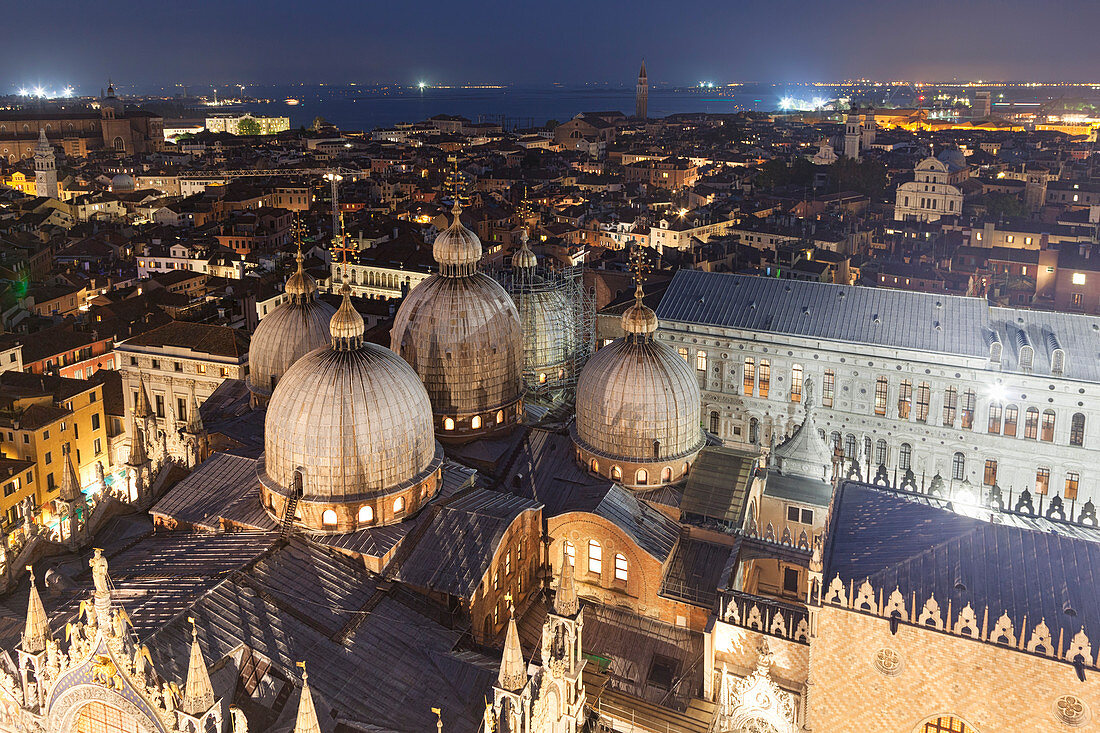The domes of St. Mark's Basilica seen from the top of St. Mark's Campanile by night, Venice, Veneto, Italy.