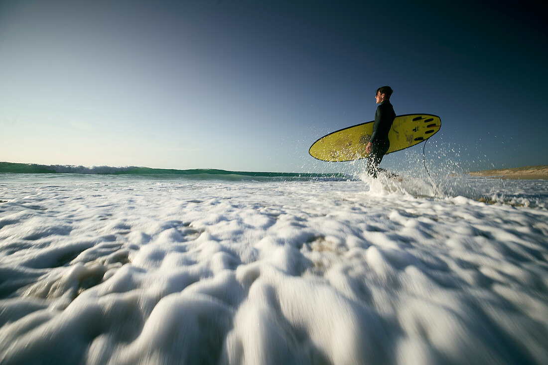 Young surfer in the surf, French Atlantic coast, Aquitaine, France