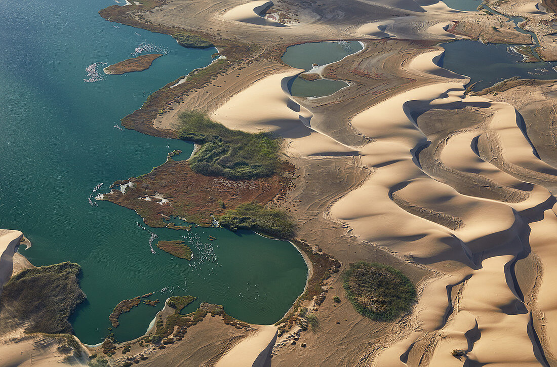 Walvis Bay lagoon and Namib desert dunes from the air, Namibia