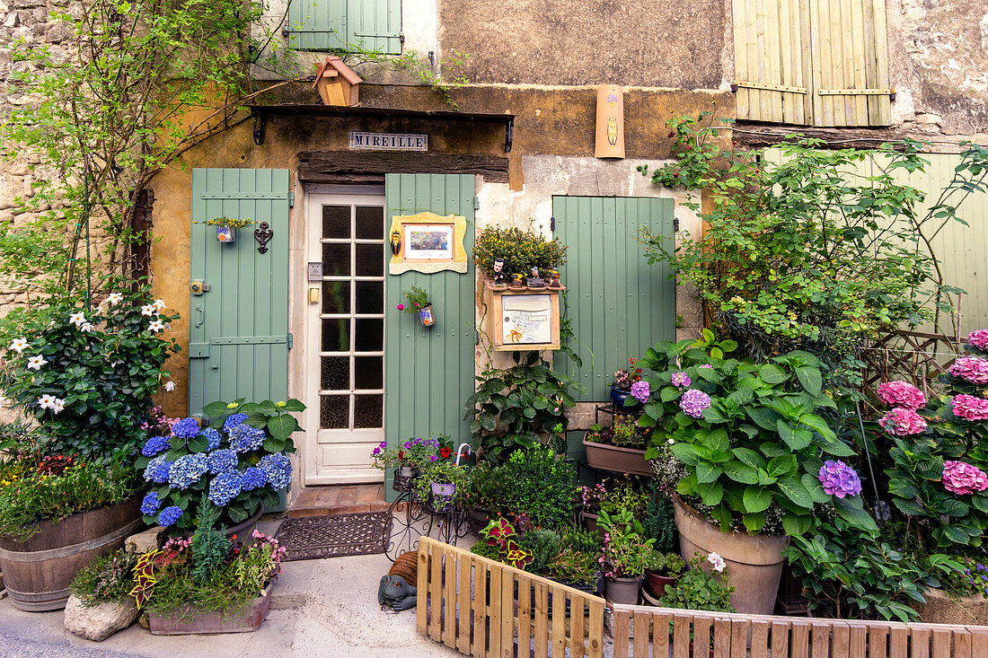 House entrance with flowers in Saignon, Vaucluse, Provence-Alpes-Cote d'Azur, France