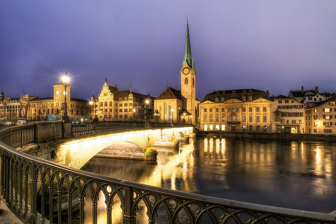 Zurich on the Limmat at dusk, Stadthaus, Fraumünster and Münsterbrücke, Switzerland