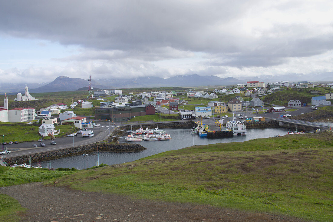 Small Village and Harbor with Mountains in Background on Cloudy Day, Stykkishólmur, Iceland