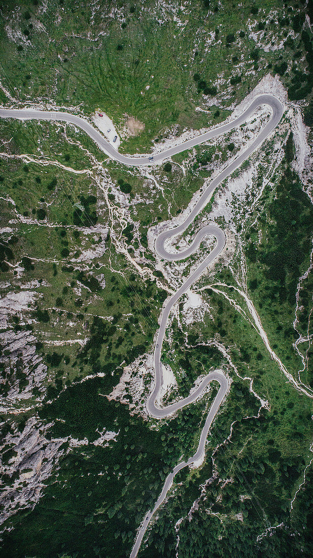 Aerial view road winding through Drei Zinnen Nature Park, South Tyrol, Italy