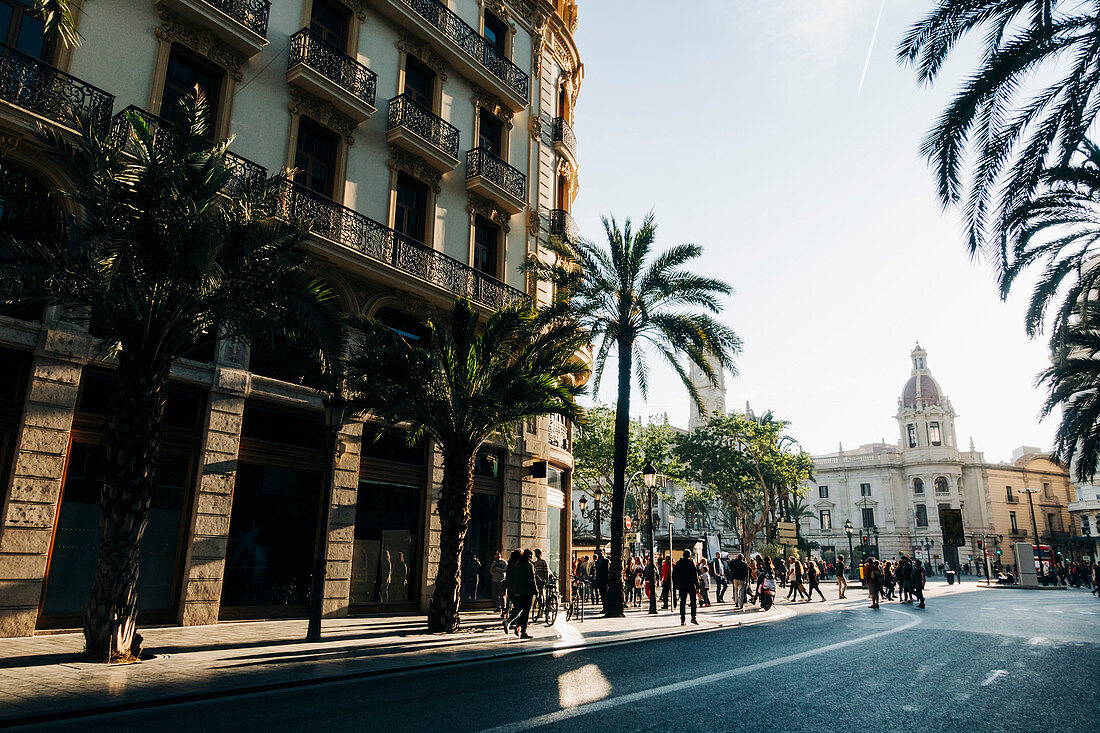 People walking around Plaza del Ayuntamiento, Valencia, Spain