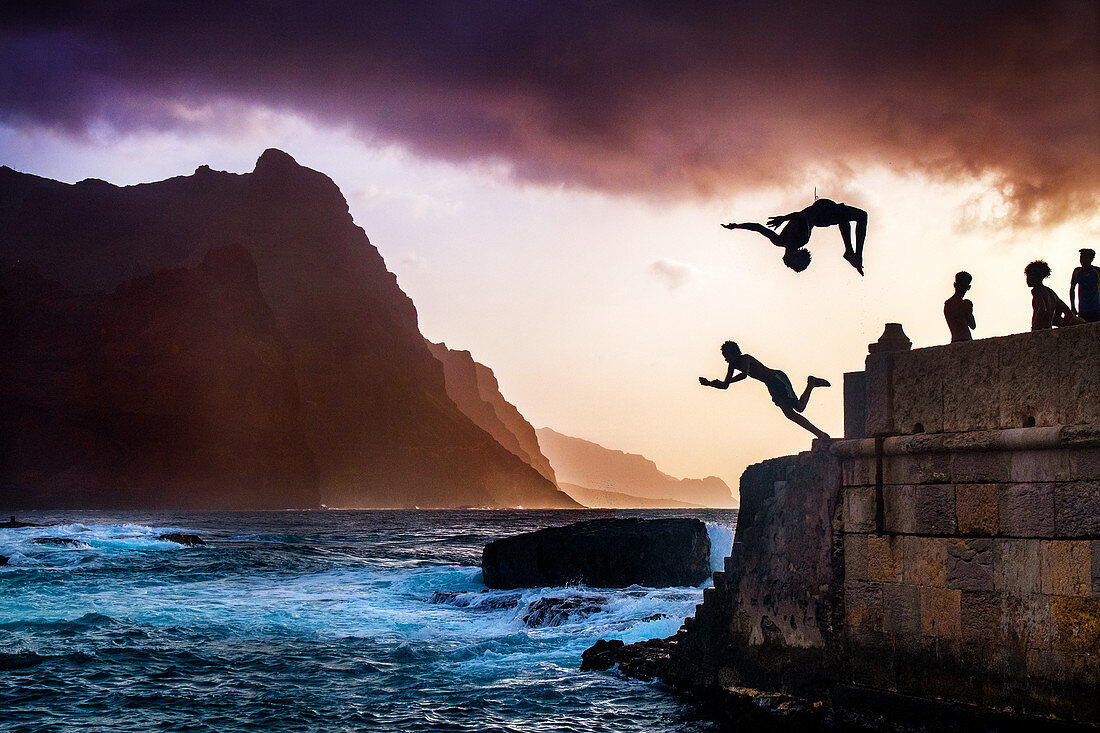 Cape Verde, Island Santo Antao, landscapes, mountains, ocean, coastline, boys diving, sunset