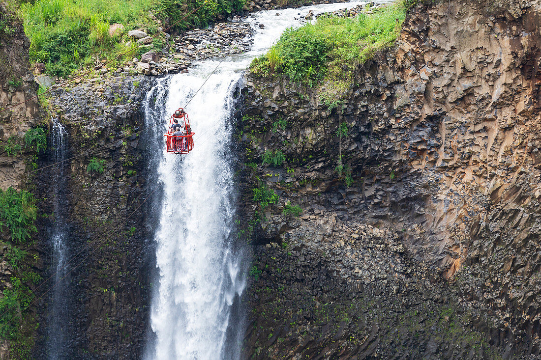 Take the funicular over the Pastaza River to the Manto de la Novia waterfall. Baños, Ecuador