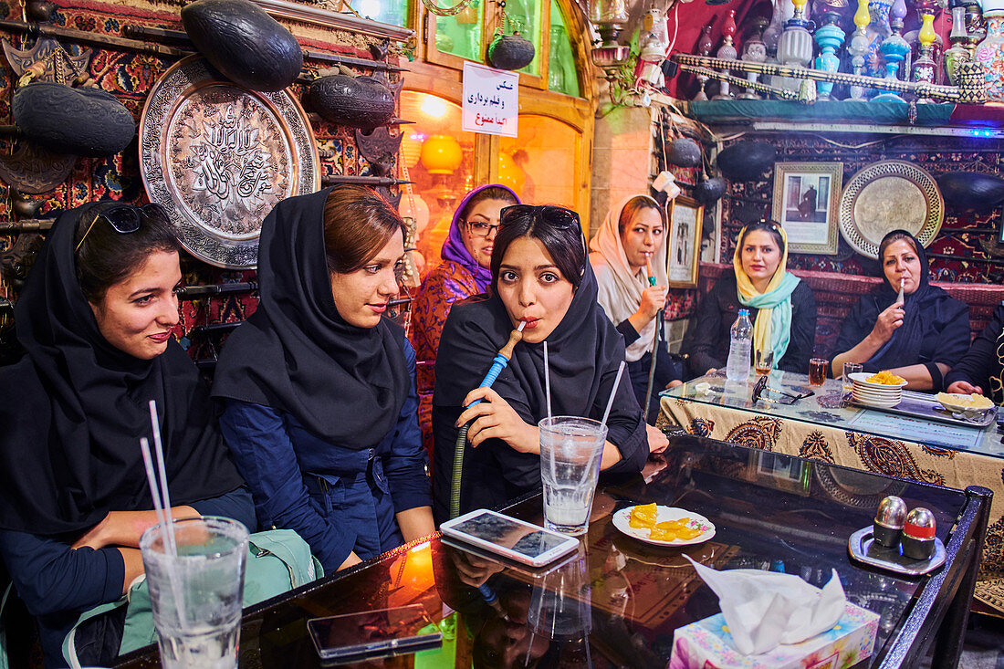 Azadegan teahouse, young women smoking a water pipe, Isfahan, Iran, Middle East
