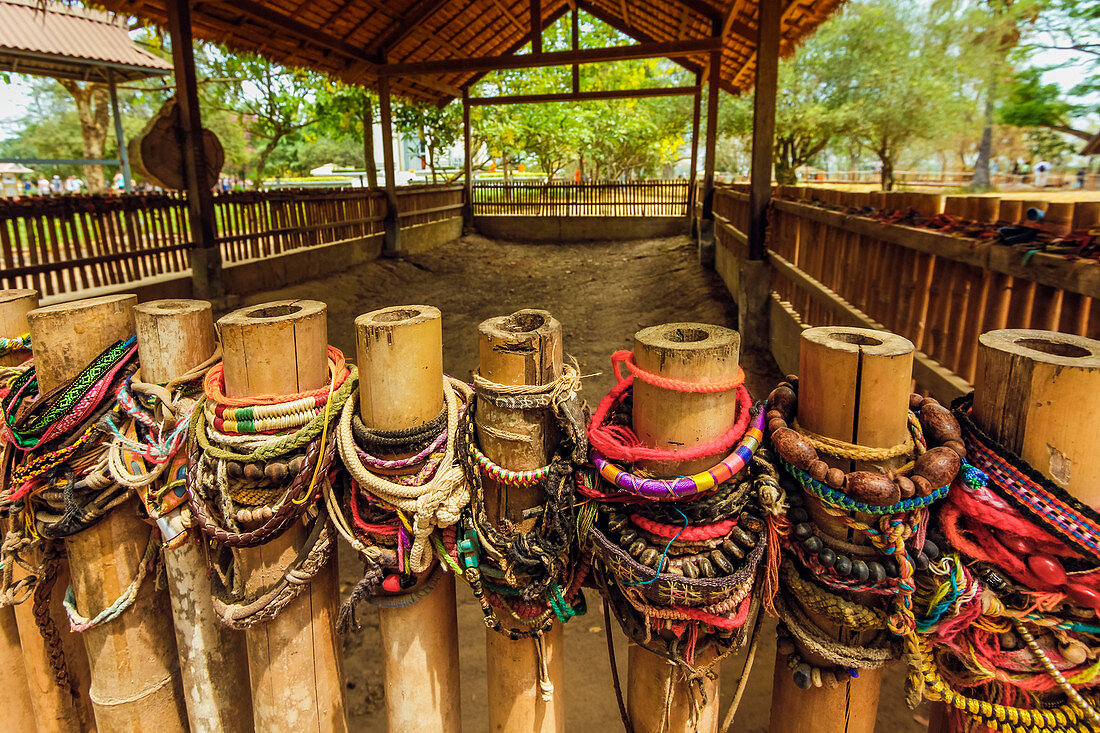Bracelets left by burial pit in the Killing Fields where 1000s were killed by the Khmer Rouge, Choeung Ek, Phnom Penh, Cambodia, Indochina, Southeast Asia, Asia