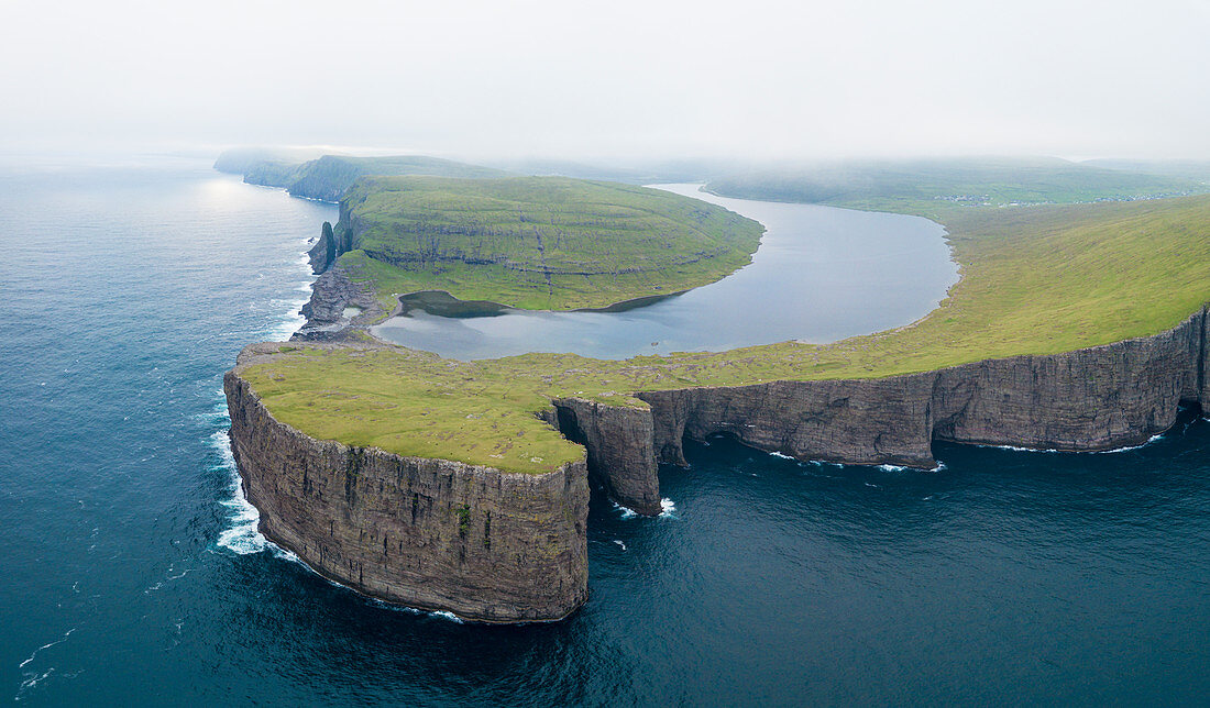 Lake Leitisvatn (Sorvagsvatn) on cliffs above the ocean, Vagar island, Faroe Islands, Denmark, Europe