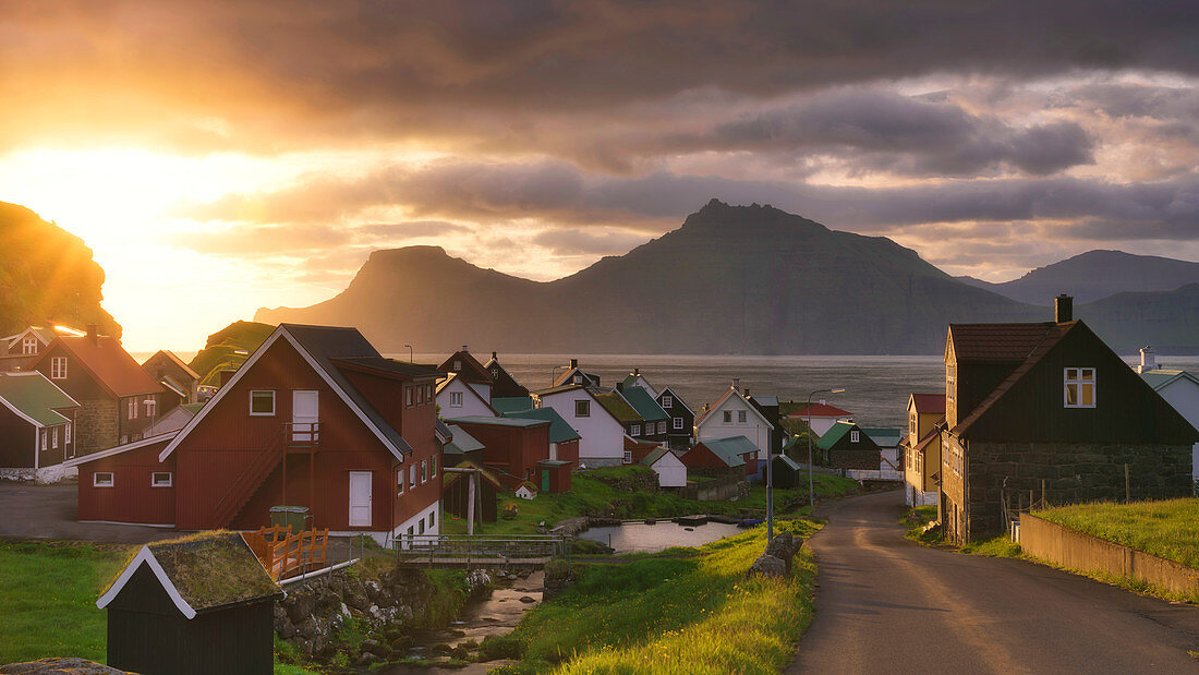 Sun rays on the traditional village, Gjogv, Eysturoy island, Faroe Islands, Denmark, Europe