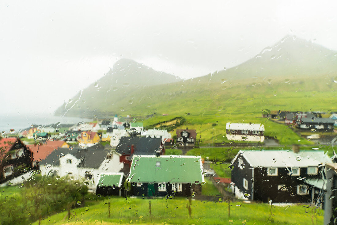 Rain on Gjogv seen through window glass, Eysturoy island, Faroe Islands, Denmark, Europe