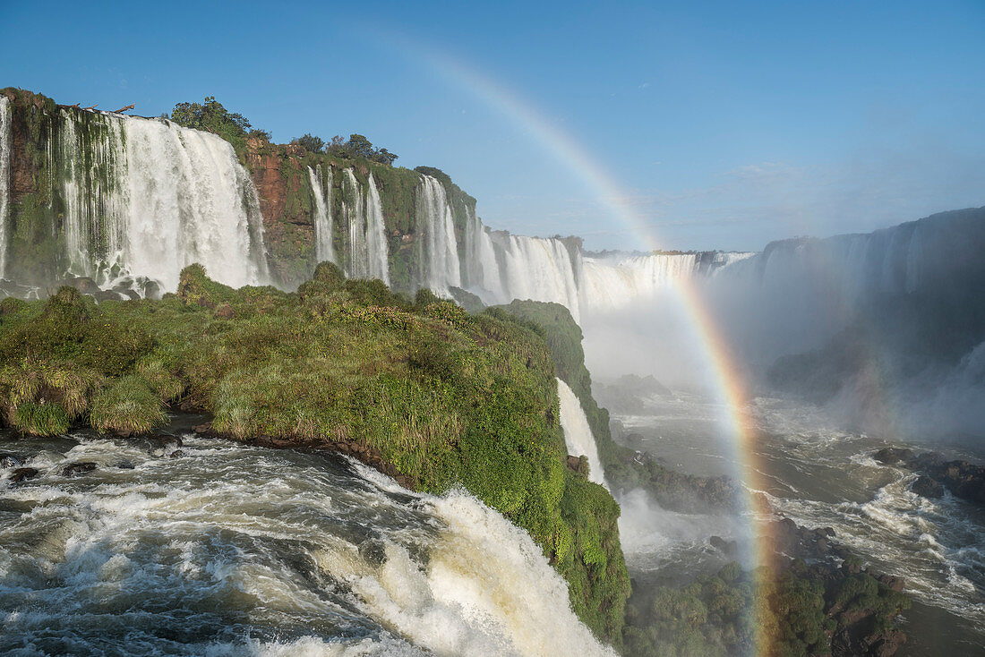 Scenic view of rainbow against splashing Iguazu Falls at Devils Throat chasm, Parana, Brazil