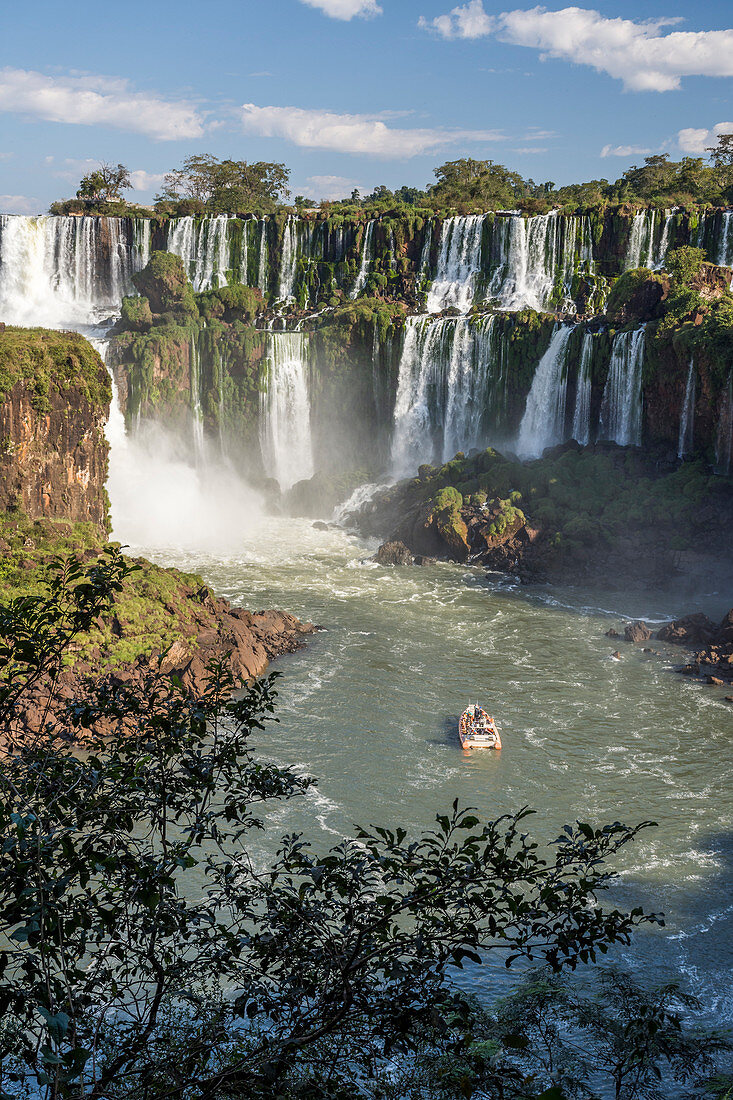 Boat in front of splashing†Iguazu†Falls during tour, Parana,†Brazil