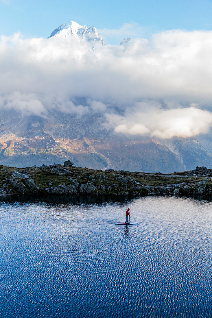 Person paddling on lac des Cheserys under lac Blanc in Chamonix, Haute Savoie, France