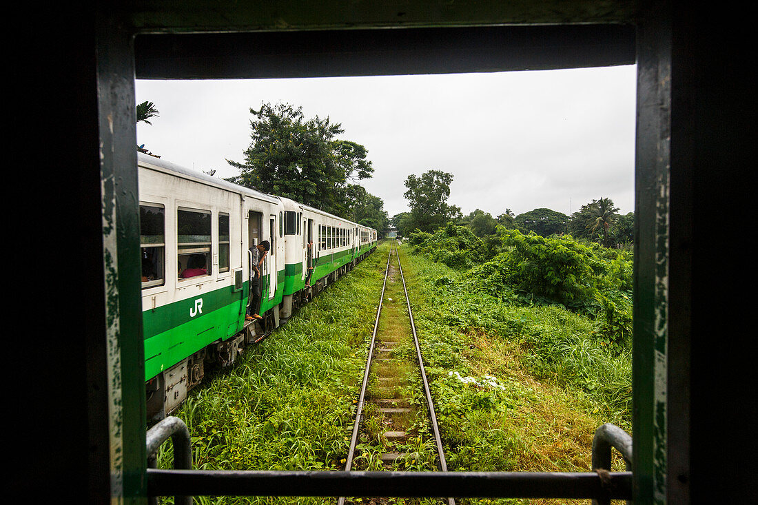 Local passengers ride Yangon Central Railway, Myanmar