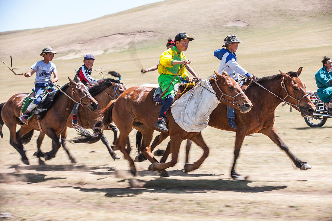 Kids aged 6-12, compete for 20 kilometers bareback horse race at Annual Naadam Festival in Bunkhan, Mongolia