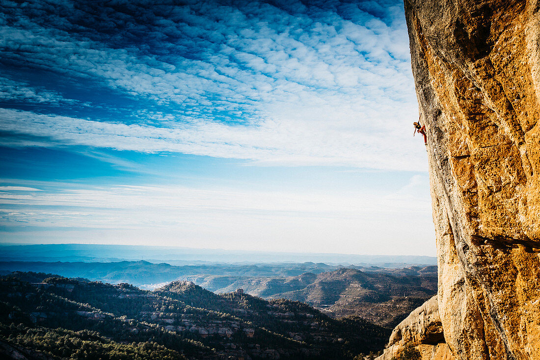 Young woman climbing cliff, Magaluf, Catalonia, Spain