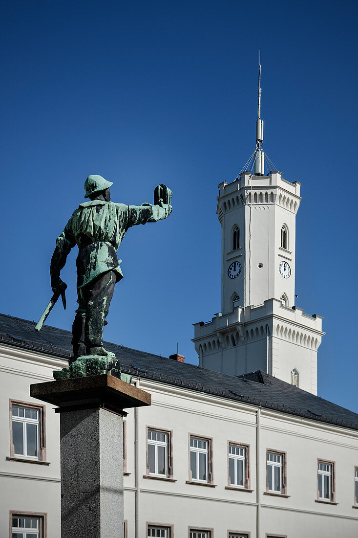 Bergmann figure in front of City Hall, Historic Old Town Schneeberg, UNESCO World Heritage Montanregion Erzgebirge, Schneeberg, Saxony