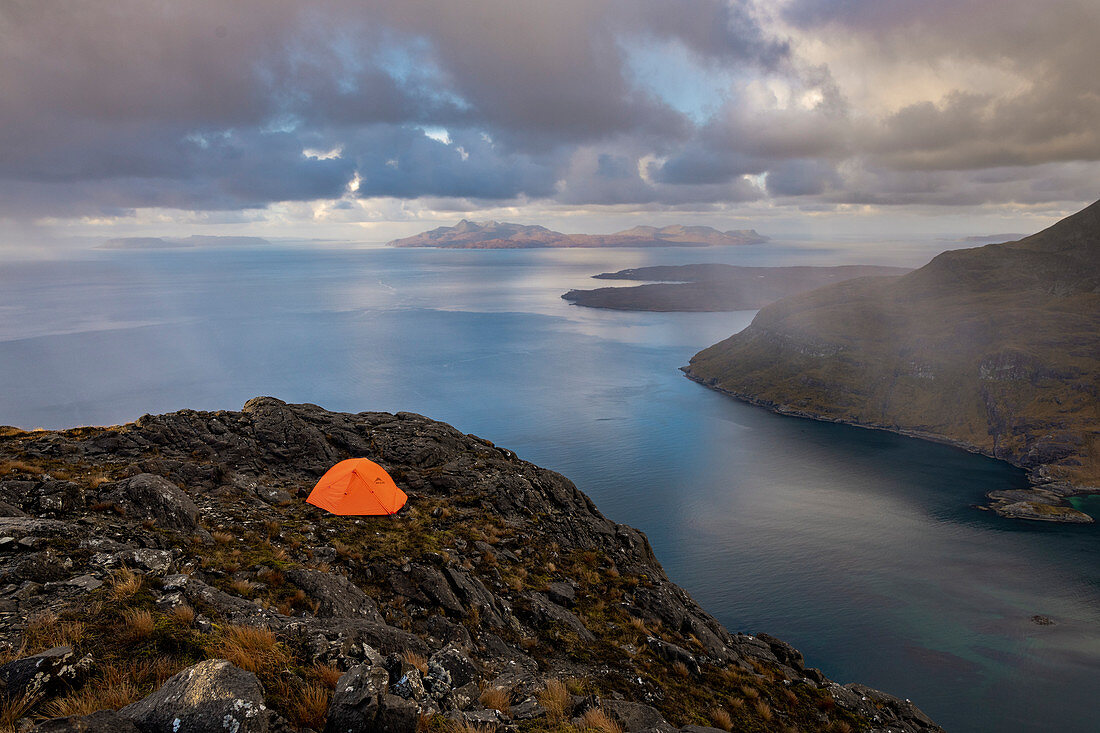 Wild camping on the top of Sgurr Na Stri on the Isle of Skye with views towards the Isle of Soay, Isle of Skye, Inner Hebrides, Scottish Highlands, Scotland, United Kingdom, Europe